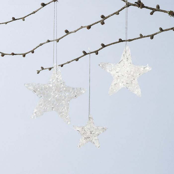 Décorations suspendues en forme d’étoile brillante réalisées avec de la colle Sticky Base et des paillettes