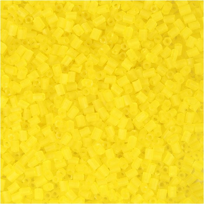 Rocailles 2-cut, d 1,7 mm, dim. 15/0, diamètre intérieur 0,5 mm, jaune transparent, 25 gr/ 1 Pq.