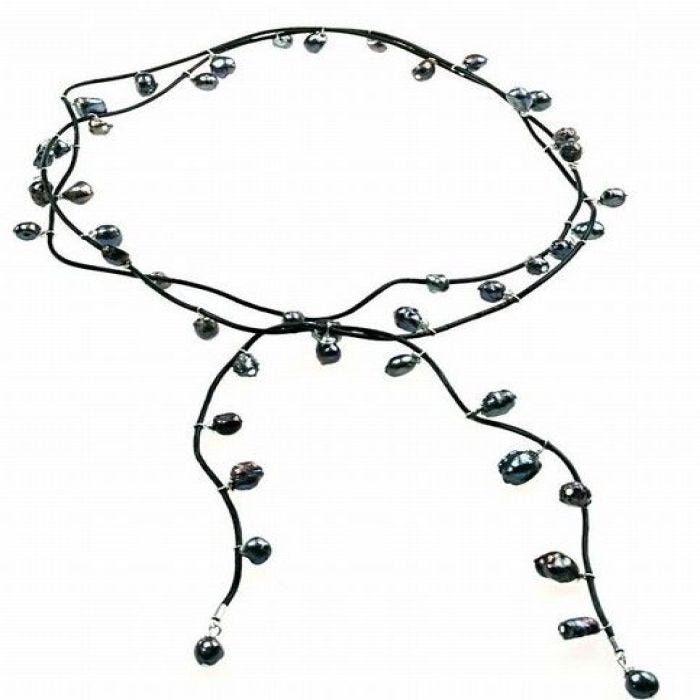 A beautiful Necklace with Freshwater Pearls on a Leather Cord