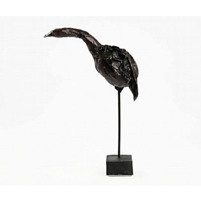Oiseau sculpté sur un bâtonnet