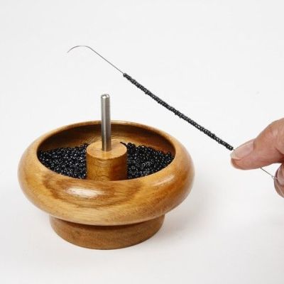 École de Bijoux : Un Porte-Breloques Rotatif