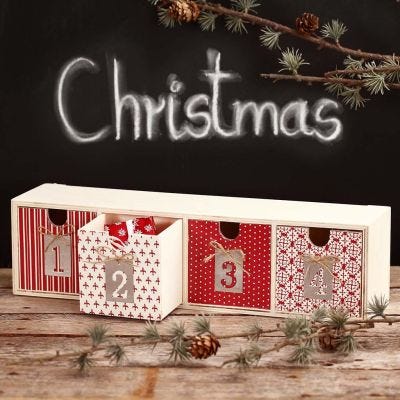 Technique de découpage sur une commode pour des cadeaux de l'Avent