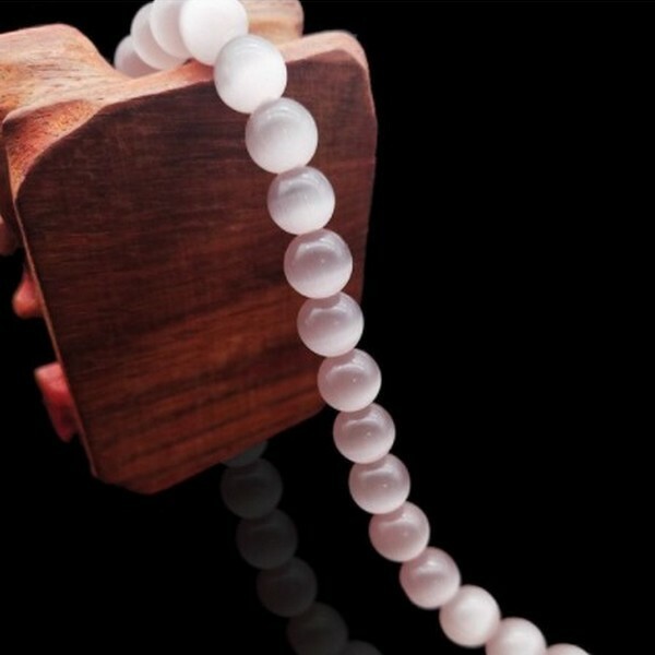Fil de 63 perles ronde naturelle 6 mm OEIL DE CHAT BEIGE ROSE - Photo n°1