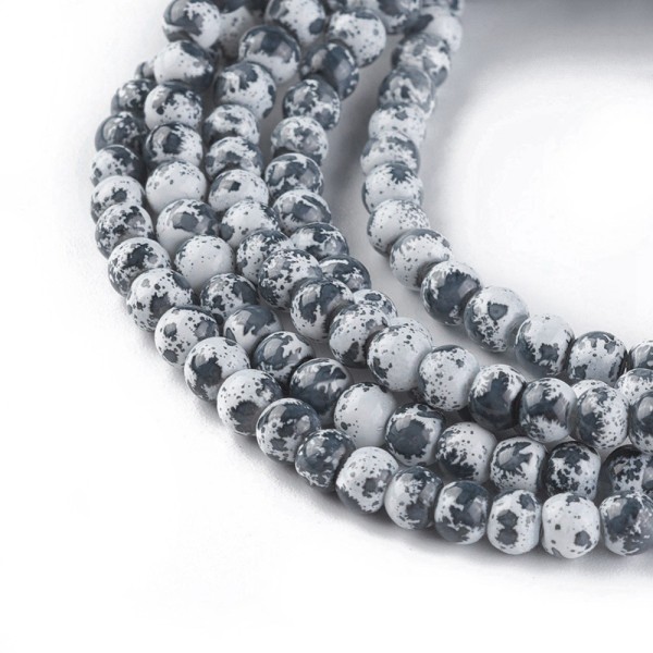 Perles en verre 4 mm blanches taches noires x 50 - Photo n°2