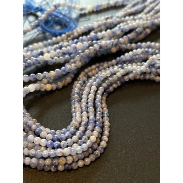 BU11220428133219 Lot d'environ 19 cm ( 1/2 fil ) Perles rondes 2 mm Pierre bleue et blanche coloris - Photo n°1