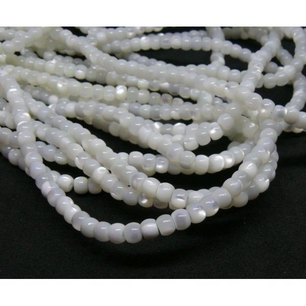 BU11220214104935AB Lot de 10 cm de perles Heishi de nacre véritable Blanc Crème Rondelle  3 par 4  m - Photo n°1