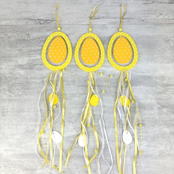 Lot de 3 Oeufs en bois jaune, longueur 40 cm, avec rubans et perles, déco porte pâques à suspendre - Photo n°1