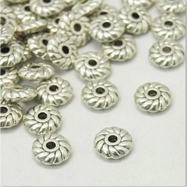 40 petites perles métal argenté antique 4 mm forme toupie CITROUILLE - Photo n°1