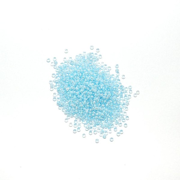 10 G  (+/- 875 perles) rocailles 11/0 transparent intérieur aquamarine - Photo n°1