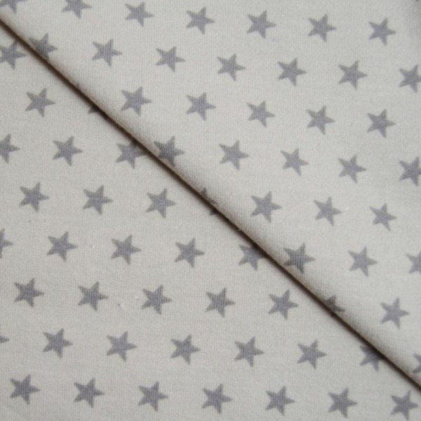 Tissu jersey coton-élasthanne beige imprimé étoiles taupes (par multiple de 20cm) - Photo n°1