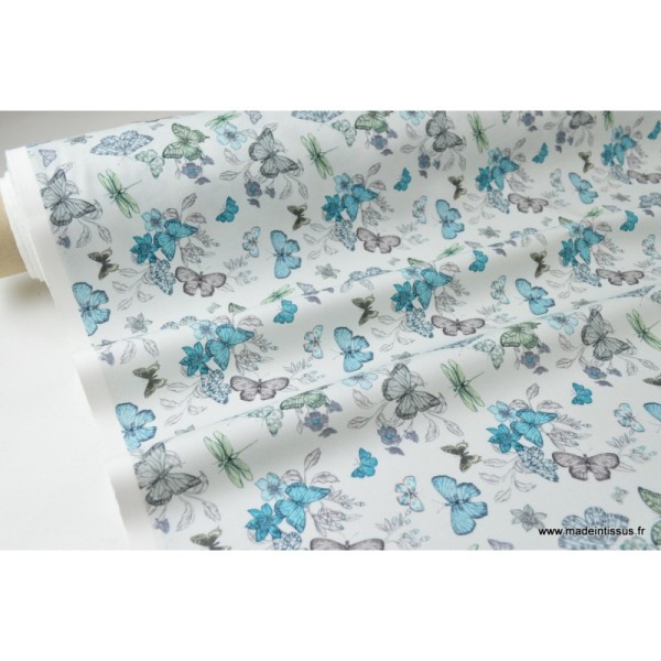 Tissu sergé coton imprimé papillons et libellules turquoise .x1m - Photo n°2