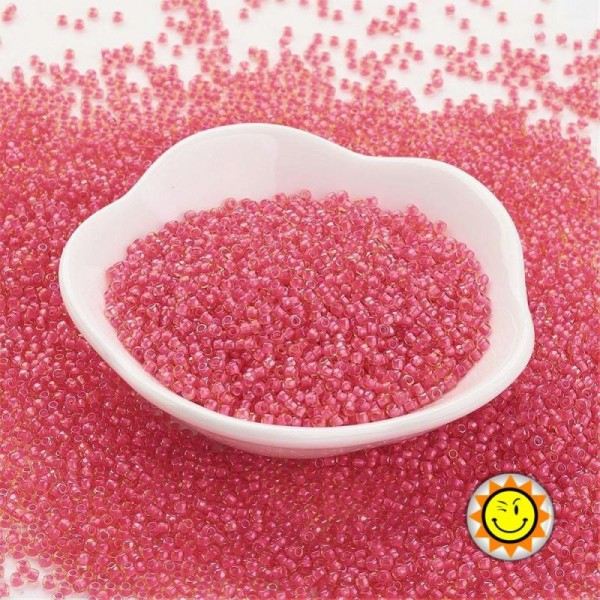 Toho rocaille #185- 11/0 couleurs interieures rose fonce 2x1.5mm - 9/10g - Photo n°1