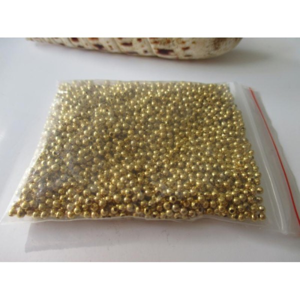 Lot de 40 gr de perles intercalaires dorées 1 mm - Photo n°1