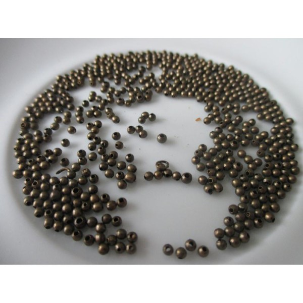 Lot de 25 gr de perles métal intercalaire bronze environ 1.5 mm - Photo n°1