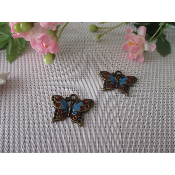 Breloque pendentif papillon bronze, bleu et rouge - Photo n°1
