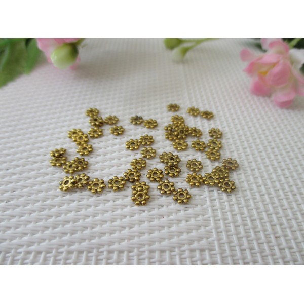 Perles métal intercalaire 4 mm fleur dorée x 100 - Photo n°1