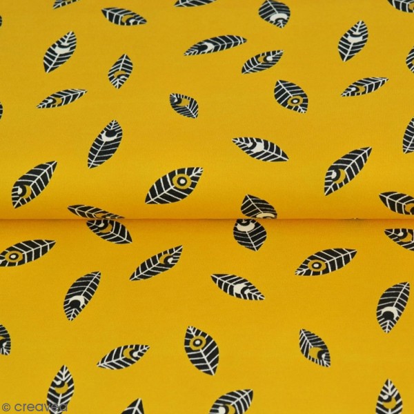 Tissu Jersey - Fond Moutarde imprimé plumes - Par 10 cm (sur mesure) - Photo n°1