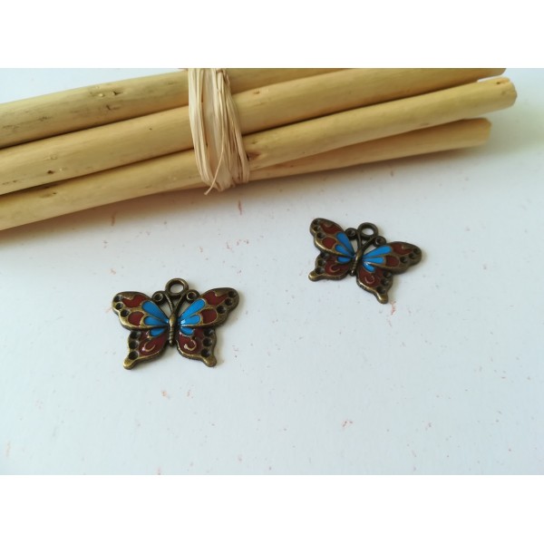 Breloques pendentif papillon bronze et émail bleu et rouge x 2 - Photo n°1