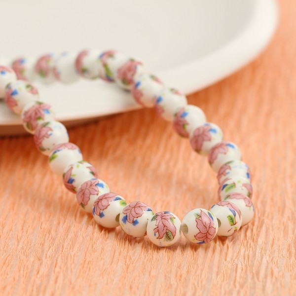 Perles en céramique ronde 9 mm blanche et rose x 10 - Photo n°1