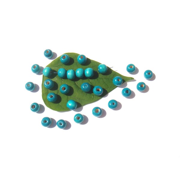 Lot 100 Perles Bois teinté Turquoise délavé 10 MM de diamètre x 9 MM - Photo n°1
