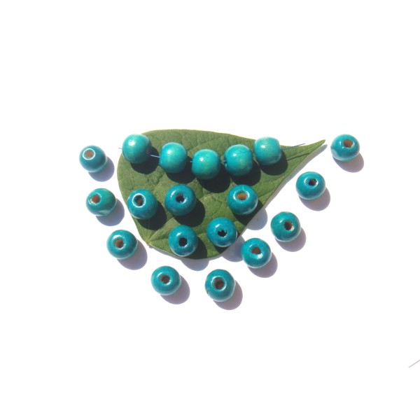 Lot 50 Perles Bois teinté Turquoise délavé 12 MM de diamètre x 11 MM - Photo n°1
