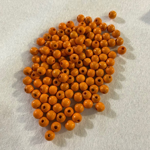 Perles en bois orange - Photo n°1