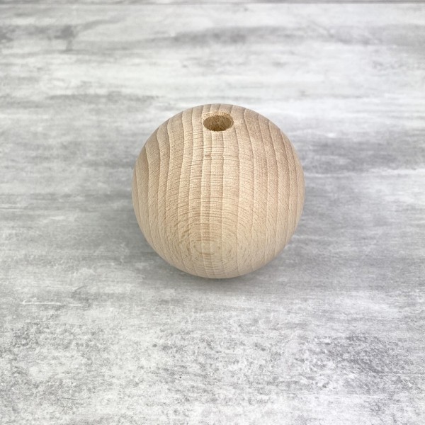 Grande Boule percée en bois de hêtre, diamètre 70 mm, perçage 10 mm - Photo n°1