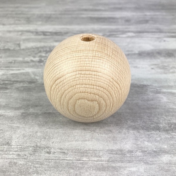 Grande Boule percée en bois de hêtre, diamètre 80 mm, perçage 10 mm - Photo n°1