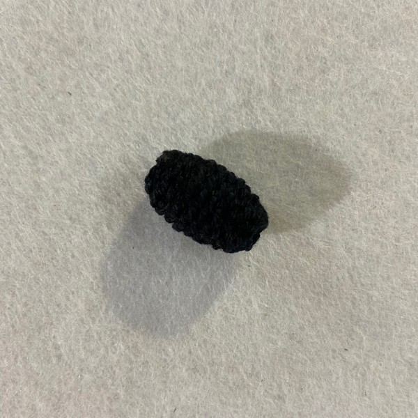 Une perle a crocheté ovale noir - Photo n°1